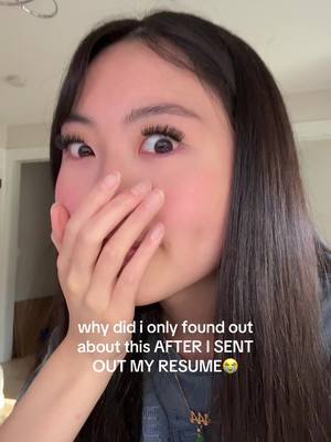 A young woman with long dark hair covers her mouth with her hand, gazing wide-eyed at the camera with a look of surprise. Text overlays on the image.