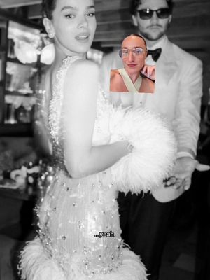 A black and white image featuring Hailee Steinfeld in a formal dress, looking over her shoulder with a slight smile. A smaller inset image shows a person in glasses. A man in a tuxedo and sunglasses stands behind Steinfeld.