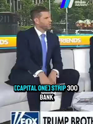 A man in a suit sits on a cream-colored sofa in what appears to be a television studio. The setting includes a cityscape in the background and the logo of a financial news network, seemingly during a live interview. Below the man, a highlighted text overlay mentions the financial network. The man is the central focus, and the overall composition implies a discussion about finance or business.