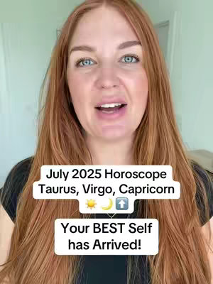 A woman with long red hair is centered in the frame. She's looking directly at the camera and speaking. The background shows a light-colored wall and a glimpse of a door, suggesting a domestic setting. Overlayed on the image is a white rectangular box containing text in a bold font. The text announces "July 2025 Horoscope for Taurus, Virgo, Capricorn," followed by icons and the phrase "Your BEST Self has Arrived!"