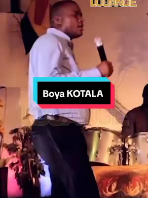 The cover image shows a man singing on stage while holding a microphone. He is wearing a light-colored shirt and dark pants. The image background features a stage setting with drum set.