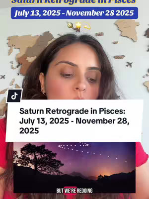 The video cover features a woman in a red top looking down, with text overlays announcing "Saturn Retrograde in Pisces" with the dates July 13, 2025 - November 28, 2025. A lower section includes a starry night landscape image. The background has a wooden world map and other decor.