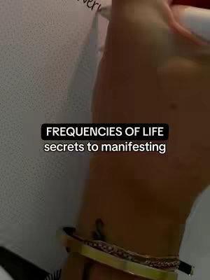 The cover image shows a close-up of a person's arm and wrist with a gold bracelet and tattoo on the wrist. A black rectangular box with white text covers part of the image