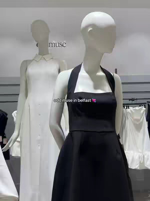 The cover image shows two mannequins in a store. The mannequin in the foreground is wearing a black dress, while the one in the background is wearing a white dress. The dresses are from the brand "Odd Muse".