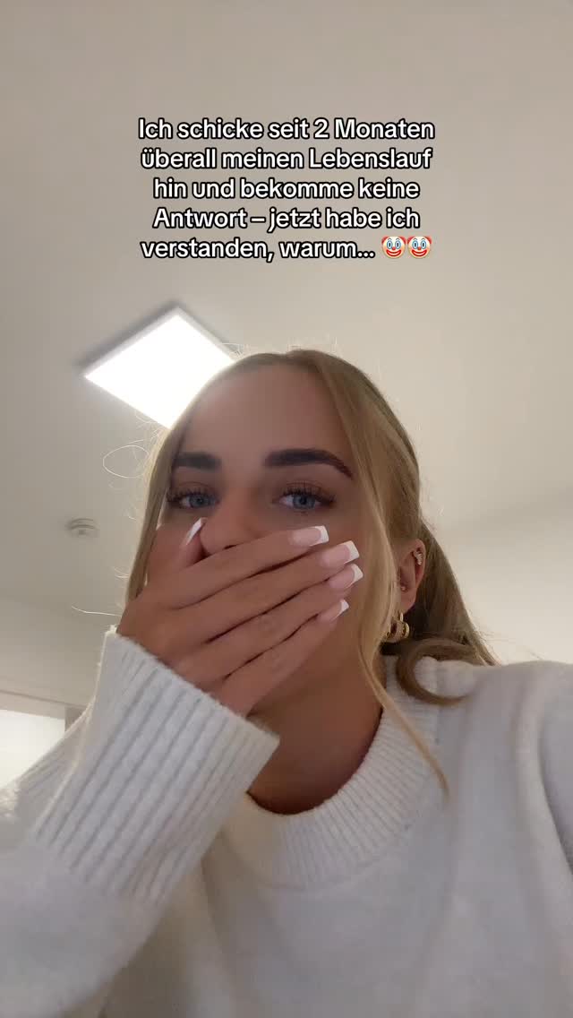 A young woman with blonde hair and blue eyes is shown in a close-up shot, covering her mouth with her hand. The background appears to be a well-lit room. Text is overlaid on the image, expressing a realization or understanding.