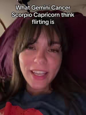 A woman with dark hair is shown in a medium close-up, looking directly at the camera while speaking. She is positioned indoors, with a deep maroon background partially visible behind her. The image is well-lit, and the woman's expression is open and engaging. Text is overlaid on the image, describing the video's topic.