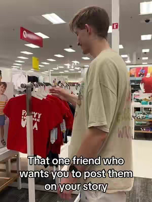 A man is standing in a store looking at clothes on a rack. Text is overlaid on the image.