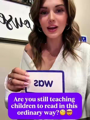 A woman is smiling while holding a flash card with the word "saw" that's upside down. There's a purple banner below with text about teaching children to read.
