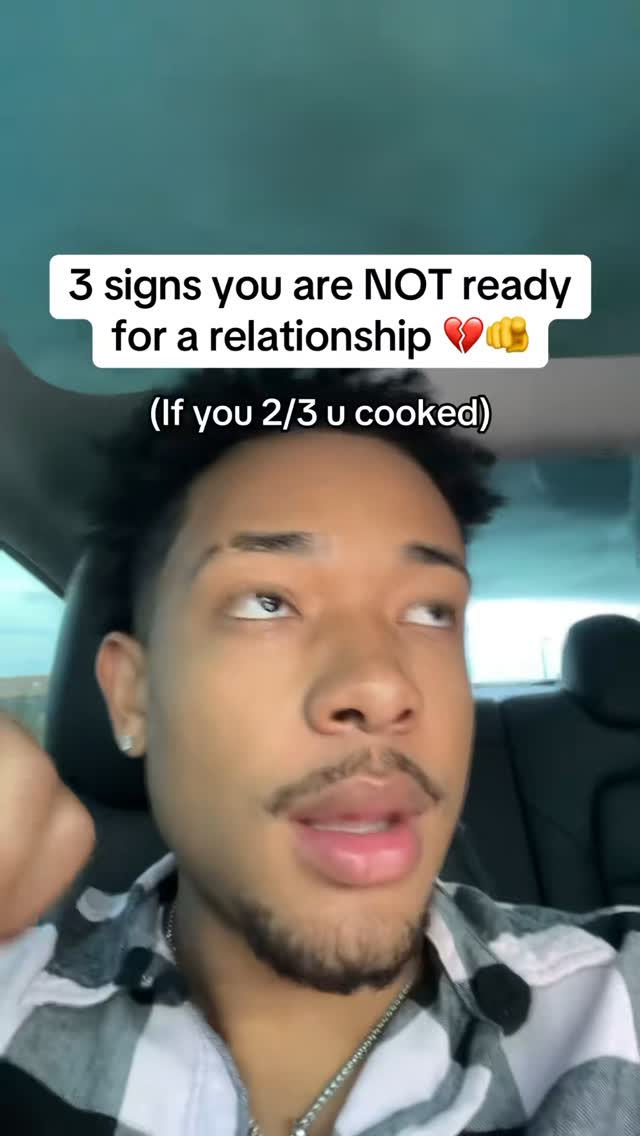 A selfie-style video cover shows a young man with a beard in a car. The man is looking up and to the right with a serious expression. Above him, there's text in a white box that reads, '3 signs you are NOT ready for a relationship...' in a bold font. Underneath, smaller text says, '(If you 2/3 u cooked)'