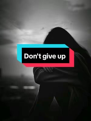 A grayscale image features a figure of a person in a fetal position or huddled pose, possibly seated, with long hair obscuring the face. The background suggests an outdoor setting with a cloudy sky. A colored text overlay reading "Don't give up" is placed in the center.