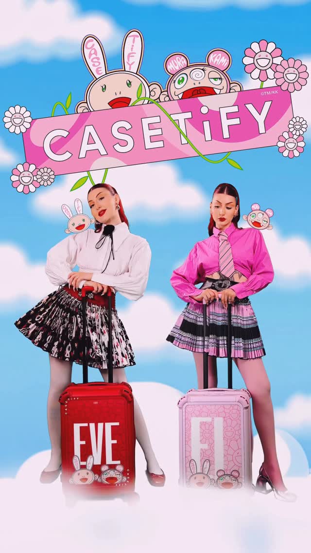 The image is a promotional shot for a collaboration, likely between a brand and an artist. It features two young women, styled to resemble each other, each posing with a vibrant, branded suitcase, set against a cheerful background of clouds and stylized flowers. Above, a playful banner proclaims "CASETIFY" along with whimsical characters and branding. The use of bright, contrasting colors and cartoonish elements creates a lively and visually appealing advertisement.