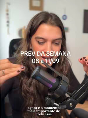 The cover image features a woman with long brown hair sitting in front of a microphone. She is wearing a black top and has her hands raised. The background is blurred, but there are hints of a room with a picture on the wall.