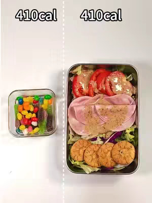 The image shows two portions of food separated by a vertical dotted line. On the left, a small glass container holds colorful candies. On the right, a rectangular container holds a salad with sliced tomatoes, ham, and round crackers or cookies. The text '410cal' is written above each food item.