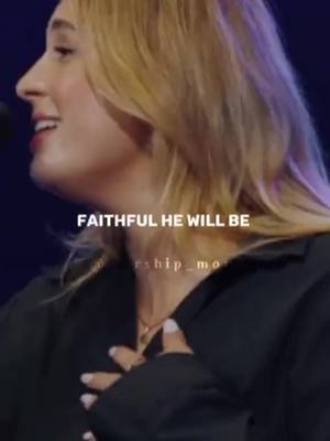 The image shows a woman from the side, with her face and hair in focus. Text overlays on the image say 'FAITHFUL HE WILL BE' written in a white font.
