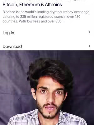 A selfie-style video cover image of a young man with dark, styled hair and a trimmed beard. He is wearing a collared shirt and facing the camera directly. The background is a blurred setting that appears dark. Overlayed at the top of the image is text about Bitcoin and Ethereum, with additional information appearing at the bottom.