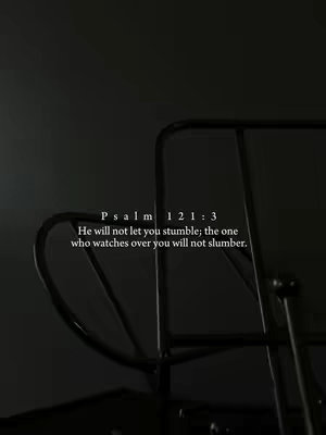 A grayscale image featuring a section of a black, metallic structure, possibly a chair back or a similar design element, set against a gradient background that transitions from a dark gray to a darker tone. The image is minimalist, emphasizing the curved lines of the structure and text overlayed on the image.