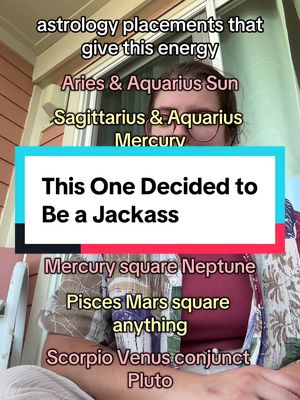 The image features a woman's upper body with text overlays. She is wearing glasses and a patterned top. The text includes astrological references and phrases like "This One Decided to Be a Jackass."