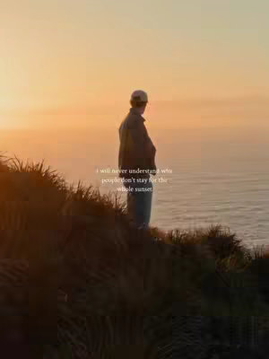 The cover image features a person silhouetted against a vibrant sunset over the ocean. The person, viewed from the back, is standing on a grassy cliff, and the text overlay reads, 'I will never understand why people don't stay for the whole sunset.'