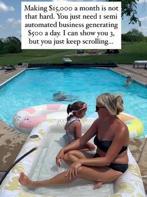 A woman and a young girl are sitting in a small pool within a larger pool, the woman is facing the camera, wearing a black bikini top and large sunglasses. The young girl is near her. A text overlay is at the top, against a green background, with text in a white rectangle. In the background, a larger pool and green scenery can be seen.