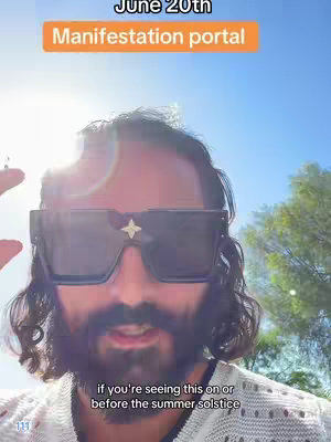 A selfie-style video shot with a man in the center, wearing large square sunglasses with a star-shaped embellishment. Above his head, the sky is a bright blue. Text overlays include 'June 20th' and 'Manifestation portal' in an orange background.