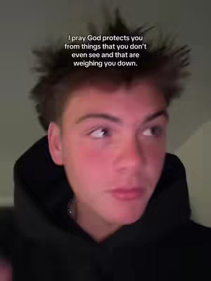 The cover image features a close-up of a young man looking upward with a slightly concerned expression. The frame focuses on his face, with a prominent text overlay. The lighting appears to be soft, and the background is out of focus, drawing attention to the subject.
