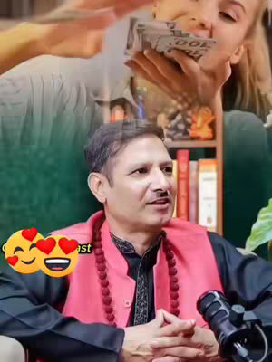 The cover image is a split composition. In the foreground, a man with dark hair and a black shirt and red vest is seated, looking towards the camera with a neutral expression; a microphone is situated in front of him. Emoticons are overlaid to the left. In the background, a woman is shown handing a wad of money over the man's head, partially obscured by the focus on the foreground figure. Elements like a bookshelf and decorative objects help suggest the setting.