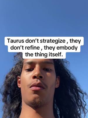 A selfie-style shot with a blue sky background. The main subject is a person with long, dark, curly hair and a neutral expression, looking at the camera. A white rectangular text overlay is positioned above their head.