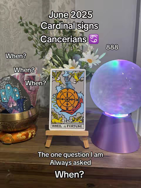 The cover image shows a still life arrangement on a wooden surface. A tarot card with the "Wheel of Fortune" is displayed on a small wooden easel. To the left, there is a decorative bowl resting on other small bowls, and in the background, there is an arrangement of flowers and a lit-up crystal ball. Text overlays with the title and questions are also visible.