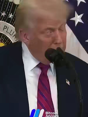 The image features Donald Trump speaking at what appears to be a press conference. He's wearing a dark suit, a red tie, and a microphone is close to his mouth. Behind him, the American flag and an emblem are visible, indicating the setting is an official one.