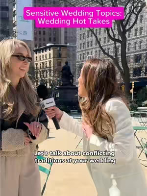 Two women are standing in front of a park. One woman is holding a microphone, and the other appears to be the interviewer. Text overlays on the image say "Sensitive Wedding Topics: Wedding Hot Takes" and "Let's talk about conflicting traditions at your wedding".