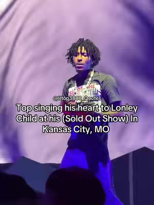 The cover image features a man on stage, singing into a microphone. The background is an out-of-focus purple, and text overlays describe the event as a performance in Kansas City.