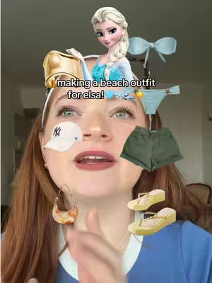 The cover image features a young woman with reddish-brown hair centered. Around her face, various fashion items are floating as if part of an outfit assembly, including an image of Elsa from Frozen, a baseball cap, a gold ring, a purse-like accessory, a bow and a pair of teal bikini bottoms with rolled-up shorts and yellow sandals. Text overlayed reads "making a beach outfit for elsa!".