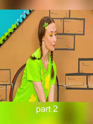 A woman with brown hair styled with braids and a green barrette is in front of a brown cardboard backdrop. She wears a green t-shirt with yellow patches. Text in the bottom center of the image reads "part 2" in white letters with a green gradient background.
