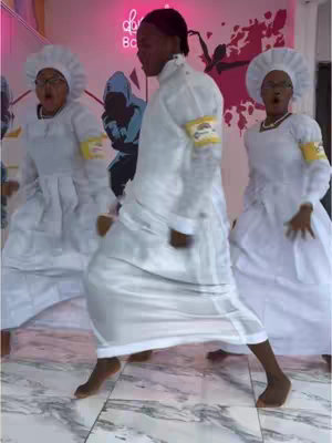 The cover image showcases three individuals in white robes and headwear dancing. The person in the middle is captured mid-step with their right foot forward. The background includes a magenta neon sign and a silhouette of dancers.