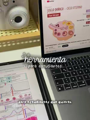 The cover image shows a desk setup with a laptop and a tablet. The laptop screen displays a detailed diagram related to the uterine cycle and ovarian cycle, including labels like “ciclo ovarico” and “fase folicular.” The tablet shows a graph and other medical diagrams. Additionally, a retro-style instant camera and some stationary are visible. Text overlayed on the image reads 'herramienta para estudiantes'.