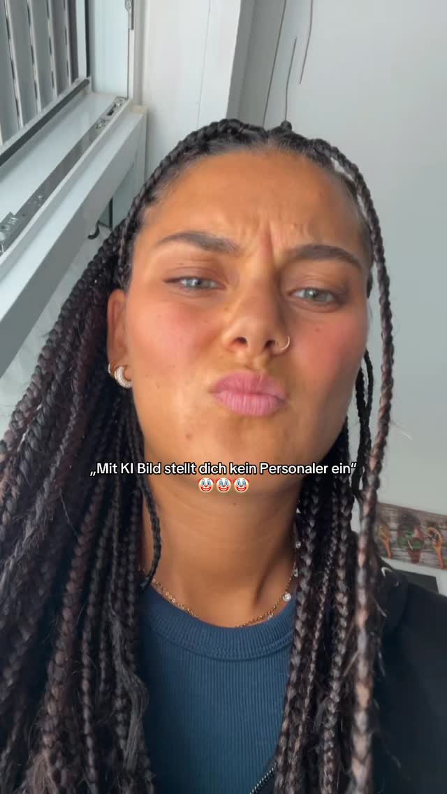 A selfie-style shot featuring a woman with dark braided hair, striking a displeased or skeptical expression. Her face is the primary focus, with her expression conveying a sense of doubt. The background shows a window and blinds.