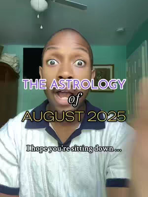 A selfie-style video cover image with a light-skinned Black man with an animated, wide-eyed expression. Text overlays in stylized fonts announce the content as a discussion of "THE ASTROLOGY of AUGUST 2025" with a lower text prompt imploring the viewer, "I hope you're sitting down...". The background appears to be a room with a ceiling fan, suggesting a casual indoor video setting.