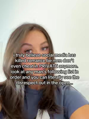 A woman with long brown hair is centered in the frame, looking at the camera. She is wearing a blue t-shirt. Text in a black font is overlaid on the image, discussing how social media has 'killed romance'. The background is out of focus.