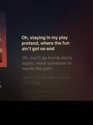 The cover image shows a dark background with white text. The text is lyrics from a song, with some words highlighted. Part of an album cover is partially visible on the left side.