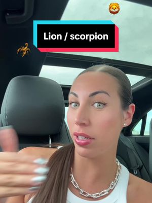 A woman is seated in a car, framed from the shoulders up. She has light skin, dark hair pulled back, green eyes, and is wearing a white top and a silver necklace. A text overlay states 'Lion / scorpion'. At the top-right corner, a lion emoji is present. A scorpion icon is at the top-left.