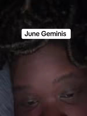The cover image is a close-up shot framing the eyes and forehead of a person. The skin tone is medium, and the lighting appears to be soft with some shadows defining the features. The person has dark, curly hair. A white rectangular text box at the top reads 'June Geminis'.