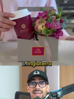 The cover image shows a man in a black cap and glasses in front of a microphone, with the background featuring a coffee cup and flowers in a gift box. The image is divided into two sections: The top section displays the coffee cup and flowers, with pink tones dominating the color palette. The bottom section showcases the man speaking into a microphone. The image is vibrant and engaging.