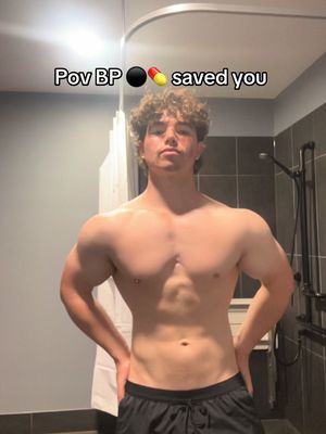 A shirtless muscular man stands in a bathroom, posing with hands on his hips. Text overlayed at the top reads 'Pov BP saved you'.