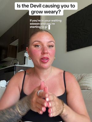 The cover image shows a woman facing the camera with text overlay. The woman has fair skin, reddish cheeks, and light-colored lipstick. She's wearing a black tank top and gold hoop earrings. Her arms are visible, along with a tattoo on her left arm. The background includes a glimpse of an apartment interior.
