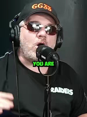 A man with a beard and sunglasses is wearing a black hat and headset, speaking into a microphone. The text overlay reads 'YOU ARE'. The background is a dark, possibly studio setting.