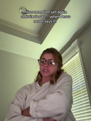 A woman with glasses is speaking, likely in a room with overhead lighting and a window.