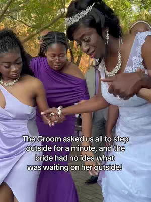 A group of women in formal dresses are outside, possibly at a wedding. The bride is the focus, in a white dress and tiara, smiling. Two bridesmaids wearing pastel purple dresses stand on either side of the bride. Text overlayed along the bottom describes the scenario.