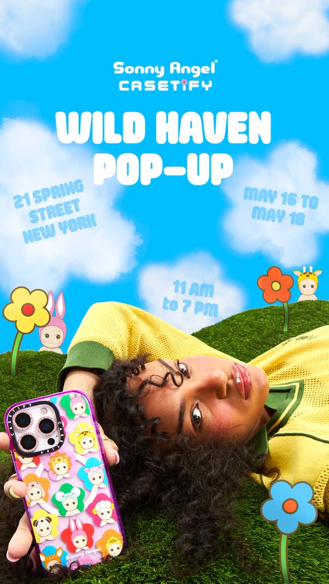 A promotional image for a pop-up shop featuring a woman with curly dark hair lying on grass, holding a phone case. The background is a bright blue sky with puffy white clouds. The person is wearing a yellow sweater and looking up at the camera. Text overlaying the image includes 'Sonny Angel' and 'CASETiFY' logos, along with the words 'WILD HAVEN POP-UP', the address, and event dates.