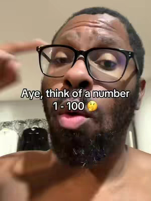Close-up shot of a Black man wearing glasses, pointing to his left while looking directly at the camera. The foreground is dominated by his face and upper chest, with his facial expression and the text overlay serving as the primary focus. He has a beard and is wearing glasses.