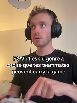 A man with light skin and blonde hair is looking up with his mouth open. Text overlay on the bottom, the man is wearing headphones and holding a controller.